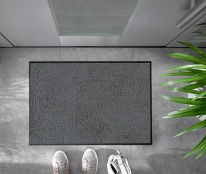 Grå dørmatte foto